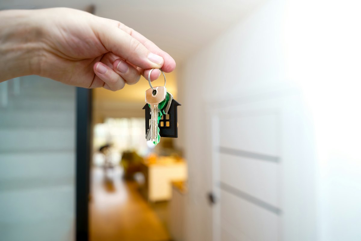 House keys handed over at a front door