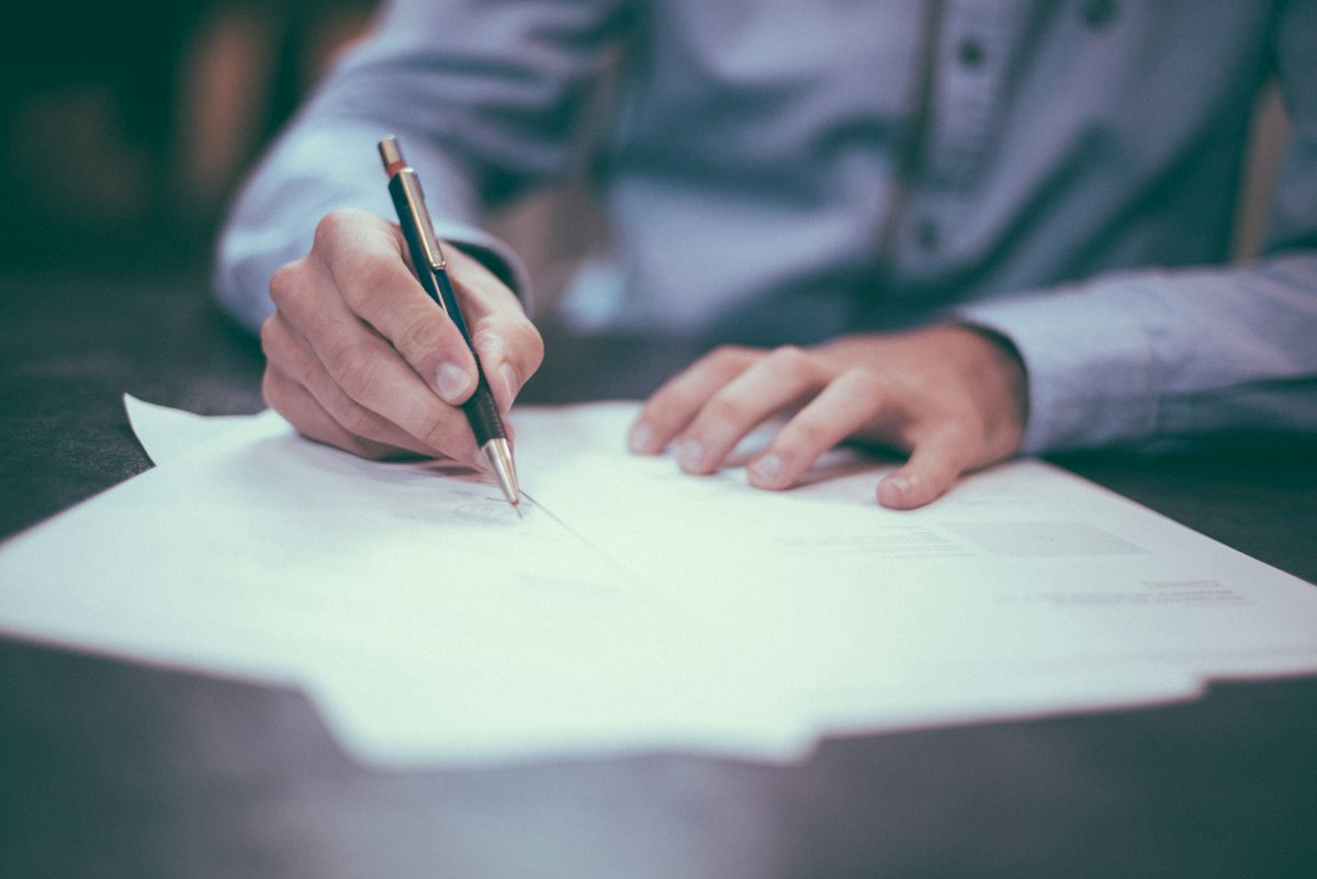 Signing a paper document